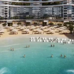 Residents enjoying artificial sandy beach and crystal lagoon at 350 Riverside Crescent in Sobha Hartland II, Dubai
