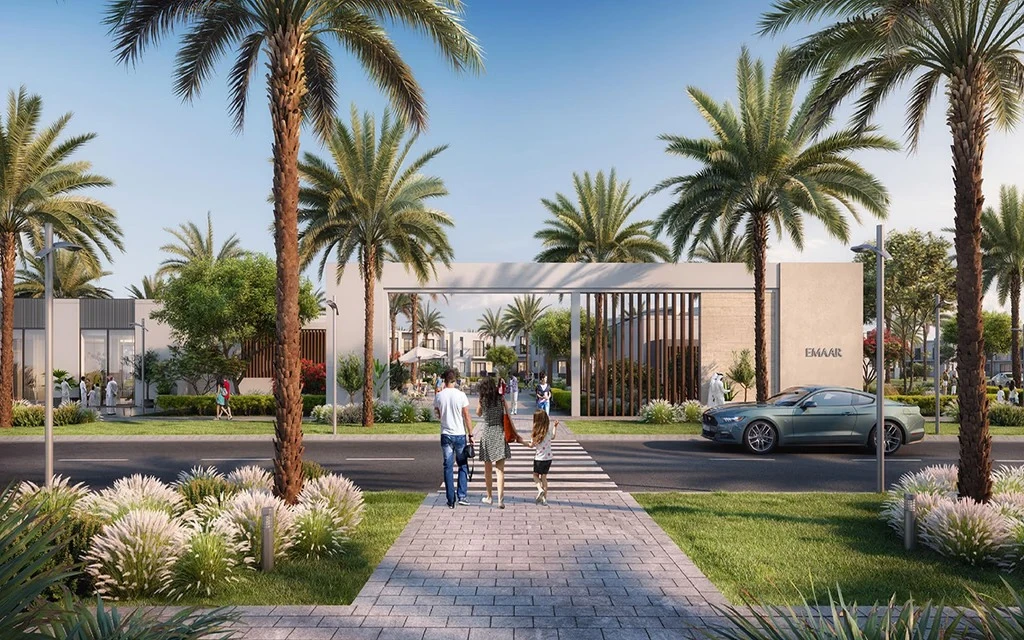 Modern gated community entrance archway with palm trees and pedestrian walkway at Urbana I in Emaar South Dubai