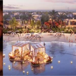 Illuminated floating cabanas on crystal lagoon beach with Dubai skyline view at DAMAC Riverside Lush