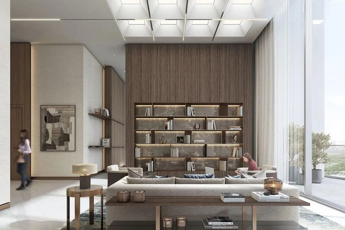Modern resident lounge with seating area and library wall at 350 Riverside Crescent in Sobha Hartland II, Dubai