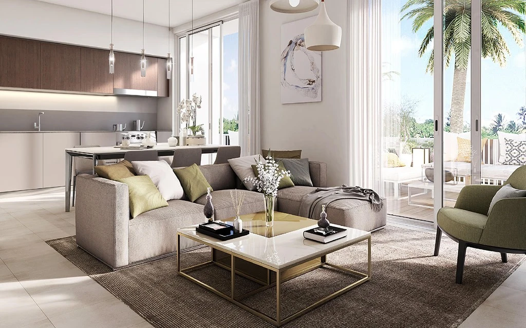 Modern open plan living room and kitchen interior with L-shaped sofa and floor-to-ceiling glass doors at Urbana I in Emaar South Dubai