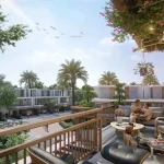 Spacious private townhouse balcony with outdoor seating overlooking green community views at Violet 3 in DAMAC Hills 2, Dubai