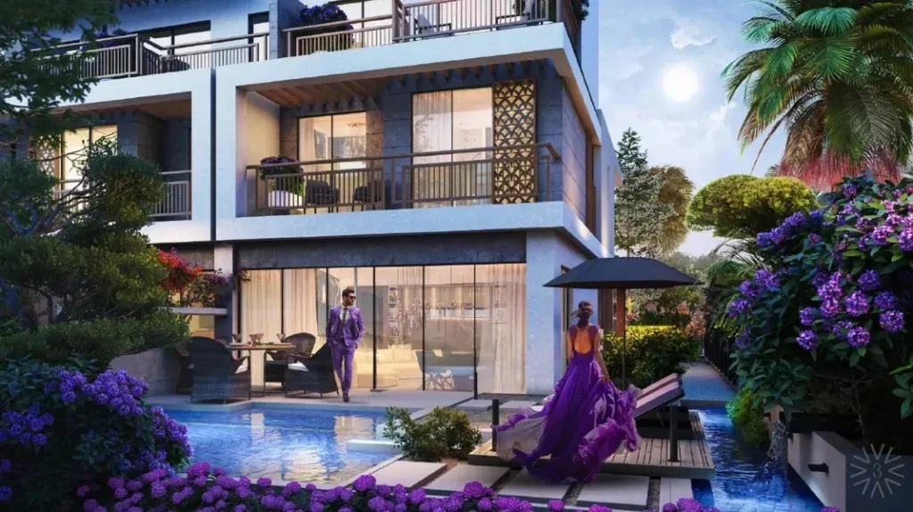 Luxury 4 bedroom townhouse exterior featuring private swimming pool, patio dining, and lush floral garden at Violet 3 in DAMAC Hills 2, Dubai