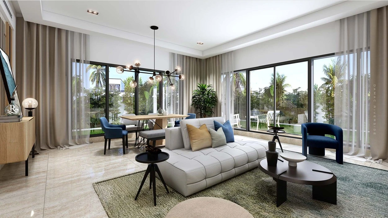 Modern open plan living room and dining area with floor-to-ceiling glass windows overlooking garden at DAMAC Riverside Lush Dubai