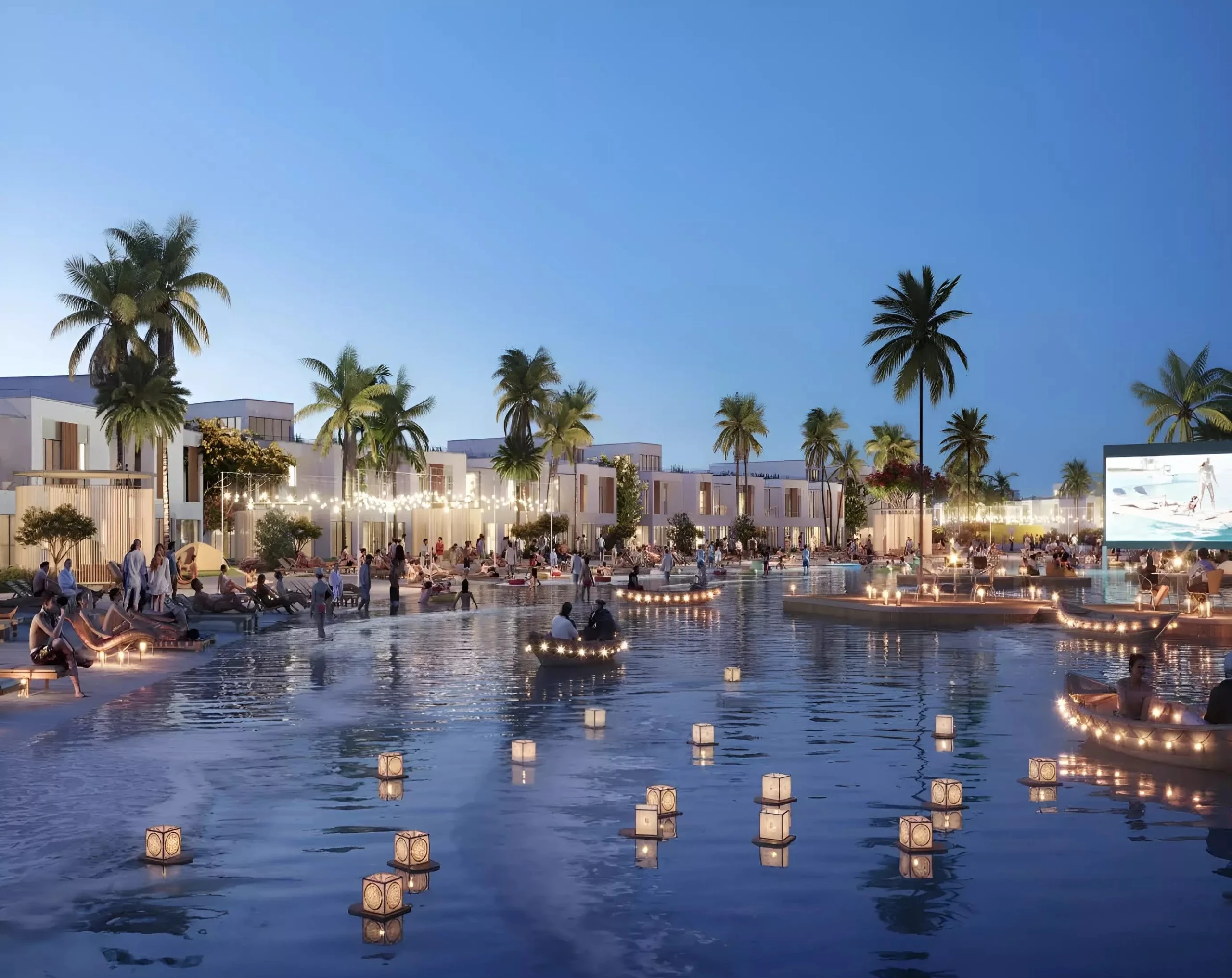 Illuminated evening view of water lagoon, floating lanterns, and community gathering spaces at DAMAC Riverside Lush Dubai