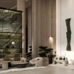Modern residential entrance lobby with marble feature wall and luxury seating area at Binghatti Amberhall in Jumeirah Village Circle, Dubai