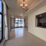 Spacious balcony with glass railing overlooking the neighborhood street at Senses at The Fields townhouse in Dubai