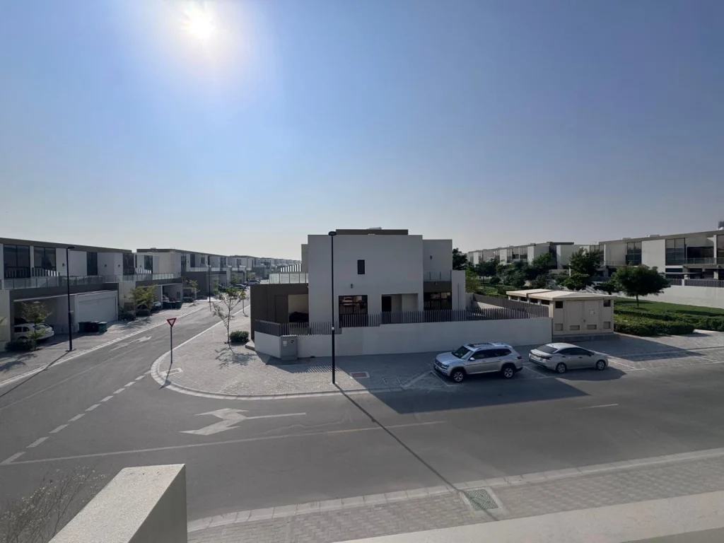 Exterior street and neighborhood view of a spacious corner 4 bedroom townhouse at Senses at The Fields Meydan Dubai
