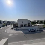 Exterior street and neighborhood view of a spacious corner 4 bedroom townhouse at Senses at The Fields Meydan Dubai